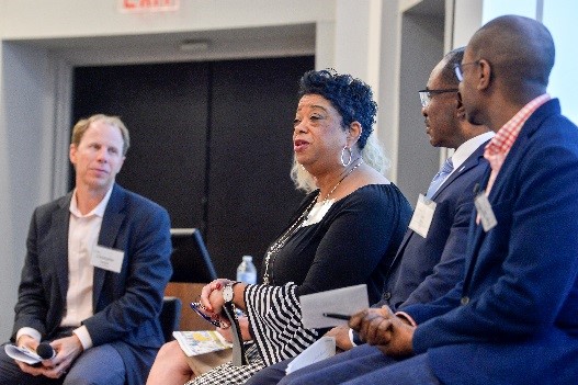 Mary Thomas, COO of The Spartanburg County Foundation, captures the audience’s attention alongside panelists (from left) Christopher Gergen, Forward Cities, Teri Lovelace, LOCUS Impact Investing (not pictured), Bernie Mazyck, SCACED, and Cedric Brown, The Kapor Center for Social Impact
