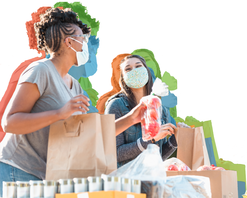 Two women packing groceries for a food drive